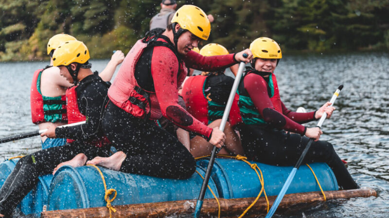 Lathallan School S6 students paddling on a raft at the annual S6 retreat 2022